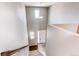 A view from the top of the staircase looking down to the front door and lower level at 25046 E Bayaud Pl, Aurora, CO 80018