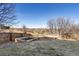 Landscaped backyard with raised garden beds at 1705 Peridot Ct, Castle Rock, CO 80108