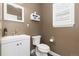 Clean bathroom with white vanity, toilet, and updated fixtures at 1705 Peridot Ct, Castle Rock, CO 80108