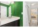 Bright bathroom with a sink, vanity, and shower at 1705 Peridot Ct, Castle Rock, CO 80108