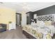 Well-lit bedroom with ensuite bathroom access at 1705 Peridot Ct, Castle Rock, CO 80108