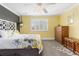 Charming bedroom with yellow walls and window seat at 1705 Peridot Ct, Castle Rock, CO 80108