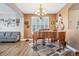 Elegant dining area with hardwood floors and a beautiful chandelier at 1705 Peridot Ct, Castle Rock, CO 80108