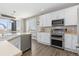 Spacious kitchen with island, stainless steel appliances, and hardwood floors at 1705 Peridot Ct, Castle Rock, CO 80108