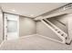 A finished basement with new carpet and neutral paint provides a versatile living space and convenient access to the upper levels at 12682 Fairfax St, Thornton, CO 80241