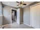 Bedroom featuring neutral walls, carpet, ceiling fan, closet and doorway to the hallway at 12682 Fairfax St, Thornton, CO 80241