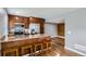 Bright, updated kitchen featuring granite countertops, stainless steel appliances, and stylish breakfast bar at 12682 Fairfax St, Thornton, CO 80241