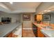 Bar area with a stone counter, wood cabinets, stainless steel appliances and plenty of counter space at 947 Dogwood Dr, Golden, CO 80401