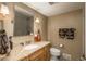Bathroom featuring a beautiful granite countertop, shower, vanity and designer towels at 947 Dogwood Dr, Golden, CO 80401