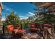 Outdoor deck with comfortable seating and tree-filled view at 947 Dogwood Dr, Golden, CO 80401
