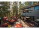 Outdoor deck with seating and a table under an umbrella and a grill at 947 Dogwood Dr, Golden, CO 80401
