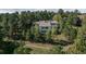 Exterior shot of house surrounded by dense trees at 947 Dogwood Dr, Golden, CO 80401