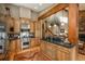 Open-concept kitchen featuring wood beams and stainless steel appliances at 947 Dogwood Dr, Golden, CO 80401