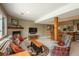 Living room with a fireplace, decorative pillows, hardwood accents and a bar area at 947 Dogwood Dr, Golden, CO 80401