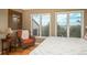 Bright main bedroom with a comfortable seating area and scenic views from the large windows at 947 Dogwood Dr, Golden, CO 80401
