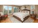Cozy main bedroom featuring a large bed, ample natural light, and a decorative bull skull at 947 Dogwood Dr, Golden, CO 80401