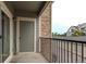 Exterior shot of the balcony with black iron railing, and attached storage unit at 4451 S Ammons St # 2-204, Littleton, CO 80123