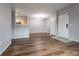 Inviting living space showcasing hardwood flooring, neutral colors, and access to kitchen at 4451 S Ammons St # 2-204, Littleton, CO 80123
