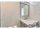 Clean bathroom features bright lighting, decorative mirror, and white marble tile at 3100 E Cherry Creek South Dr # 1101, Denver, CO 80209