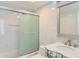 Elegant bathroom with glass shower, sleek tile, and mirrored vanity at 3100 E Cherry Creek South Dr # 1101, Denver, CO 80209