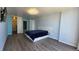 Spacious bedroom with hardwood floors, contemporary bedframe, and recessed lighting at 3100 E Cherry Creek South Dr # 1101, Denver, CO 80209