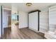 Bright bedroom with hardwood floors, built-ins, and views of the cityscape at 3100 E Cherry Creek South Dr # 1101, Denver, CO 80209