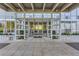 Building entrance with gray metal and glass facade, welcoming visitors into a modern residence at 3100 E Cherry Creek South Dr # 1101, Denver, CO 80209