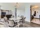 Dining area with a glass table and scenic views from large windows, open floorplan with kitchen access at 3100 E Cherry Creek South Dr # 1101, Denver, CO 80209