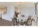 Dining area with a glass table and scenic views from large windows, next to modern kitchen at 3100 E Cherry Creek South Dr # 1101, Denver, CO 80209