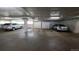 Parking garage featuring assigned parking spots and storage lockers at 3100 E Cherry Creek South Dr # 1101, Denver, CO 80209