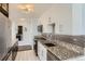 Bright kitchen features white cabinets, granite countertops, and stainless steel appliances at 3100 E Cherry Creek South Dr # 1101, Denver, CO 80209