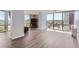 Bright living room features wood floors and large windows with views of the cityscape at 3100 E Cherry Creek South Dr # 1101, Denver, CO 80209