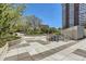 Outdoor patio area with benches, planters, bike racks, and views of the building at 3100 E Cherry Creek South Dr # 1101, Denver, CO 80209