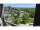 Picturesque window view of a complex with tennis courts and a stream at 3100 E Cherry Creek South Dr # 1101, Denver, CO 80209
