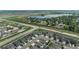 Aerial shot showcasing the neighborhood, nearby lake, and roads surrounding the property at 2200 Cadman St, Berthoud, CO 80513