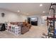 Comfortable basement living room with a large sectional sofa, TV, and exercise equipment at 2200 Cadman St, Berthoud, CO 80513