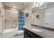 Full bathroom with a shower-tub combo, granite vanity, and decorative accents at 2200 Cadman St, Berthoud, CO 80513
