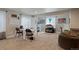 Study room with large windows, desks, chairs, and natural light at 2200 Cadman St, Berthoud, CO 80513