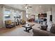 Spacious living room offering lots of natural light with an open concept and view of the kitchen at 2200 Cadman St, Berthoud, CO 80513