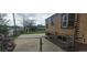 Spacious backyard featuring a lawn, brick home, and a metal fence at 9120 Elm Ct, Denver, CO 80260