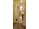 Charming bathroom includes built-in storage, a tub, and natural light at 9120 Elm Ct, Denver, CO 80260