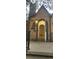 Inviting entryway showcasing the arched doorway and a glimpse of the interior at 9120 Elm Ct, Denver, CO 80260