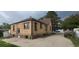 Rear view of brick home with access to a backyard with large grassy area at 9120 Elm Ct, Denver, CO 80260