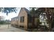 Brick home exterior displaying side yard, fenced yard, and access to backyard at 9120 Elm Ct, Denver, CO 80260