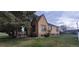 Charming brick home featuring a well-maintained lawn and mature trees, creating a cozy curb appeal at 9120 Elm Ct, Denver, CO 80260