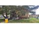 Charming brick home with a well-maintained lawn and mature trees, offering a cozy and inviting curb appeal at 9120 Elm Ct, Denver, CO 80260