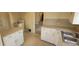 Spacious kitchen boasts a cooktop, double sink, and ample cabinet space at 9120 Elm Ct, Denver, CO 80260