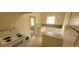 Bright kitchen features white cabinets and appliances, tiled countertops, and a breakfast bar at 9120 Elm Ct, Denver, CO 80260