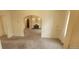 Living room with carpet, arched doorway, decorative sconces, and fireplace at 9120 Elm Ct, Denver, CO 80260