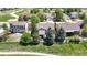 Aerial view of a home with a large backyard, mature trees, and a cozy patio area at 20855 Omaha Ave, Parker, CO 80138